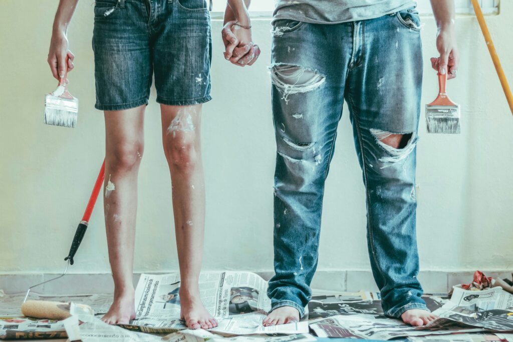 couple holding hands while renovating