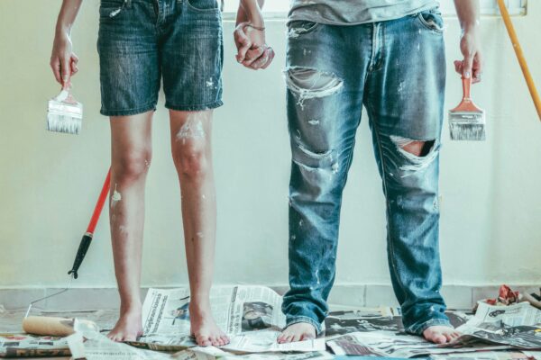 couple holding hands while renovating